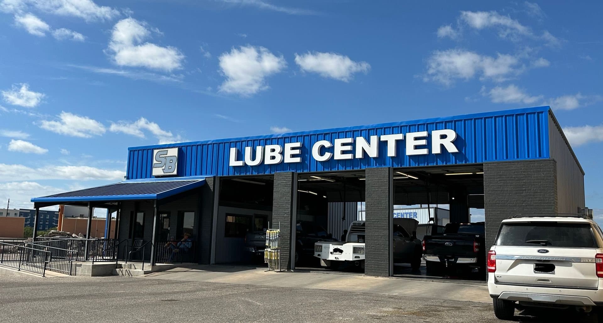 The blue Lube Center building on Sherwood Way